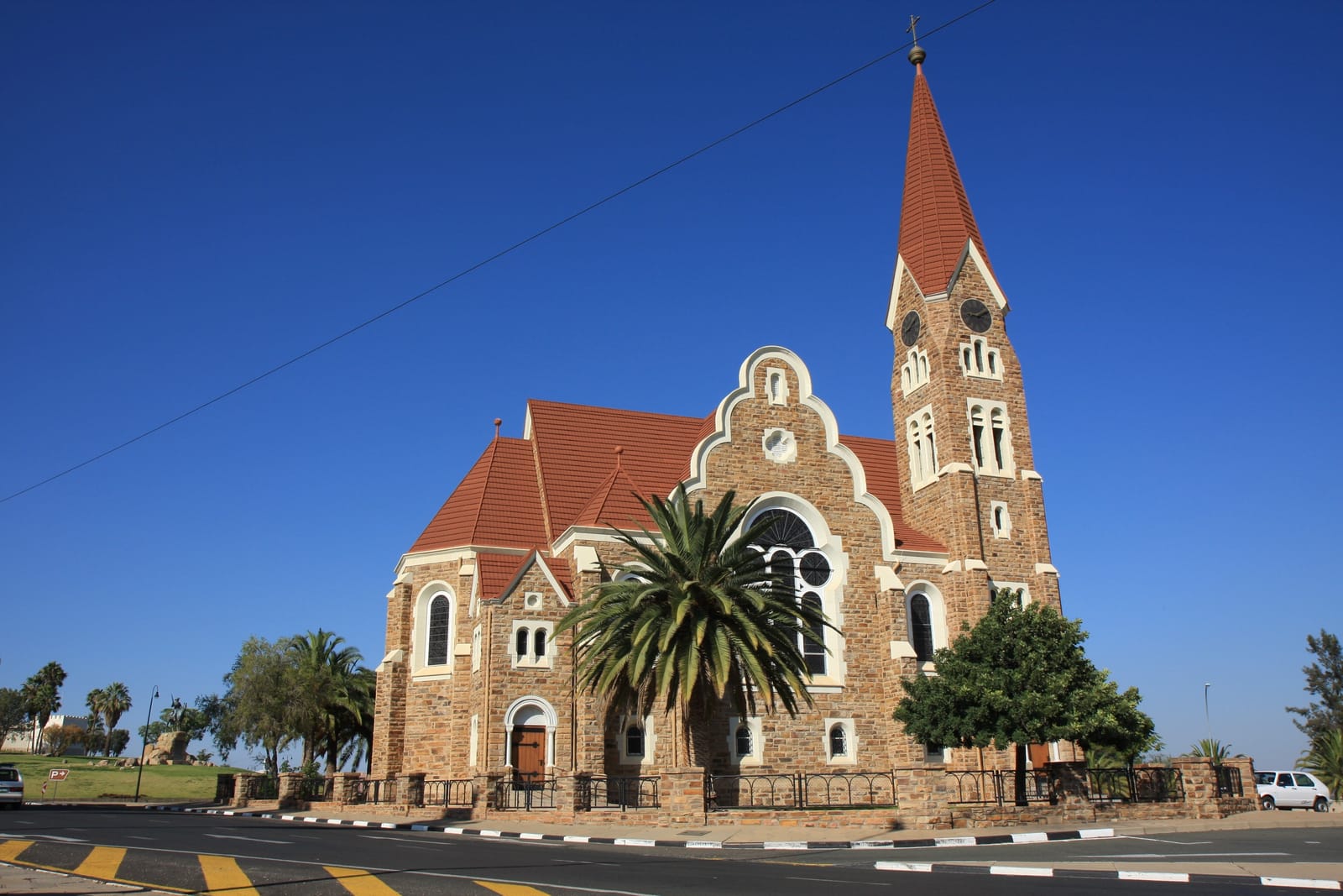 Christ Church in Windhoek with palm trees against a blue sky